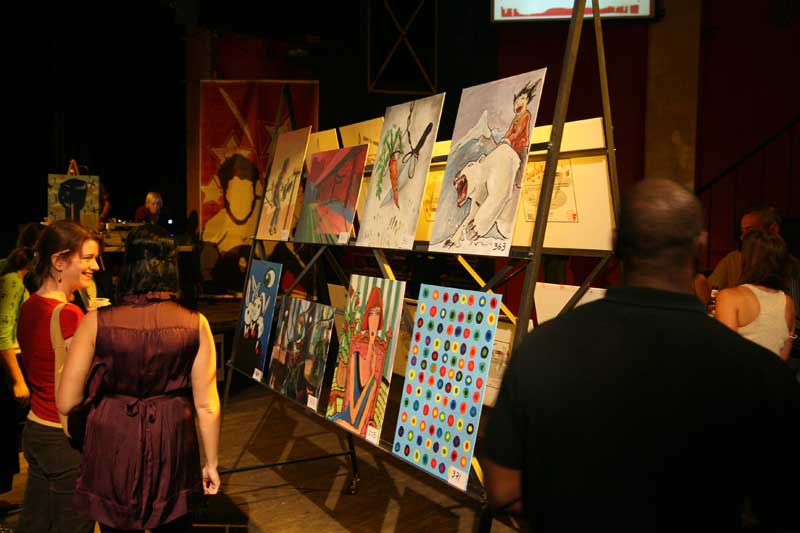 Some of the 32 paintings on display for voting before the head-to-head battles at The Vogue. All of the paintings can be seen at www.artvsart.com