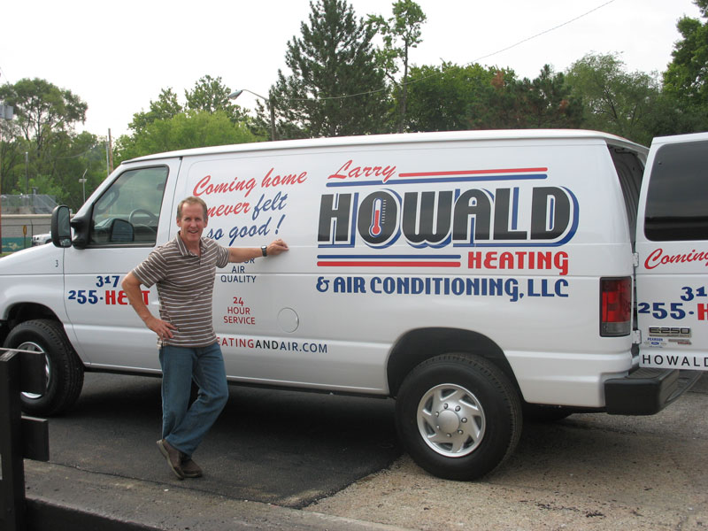 Larry Howald with one of his new heating and A/C trucks.