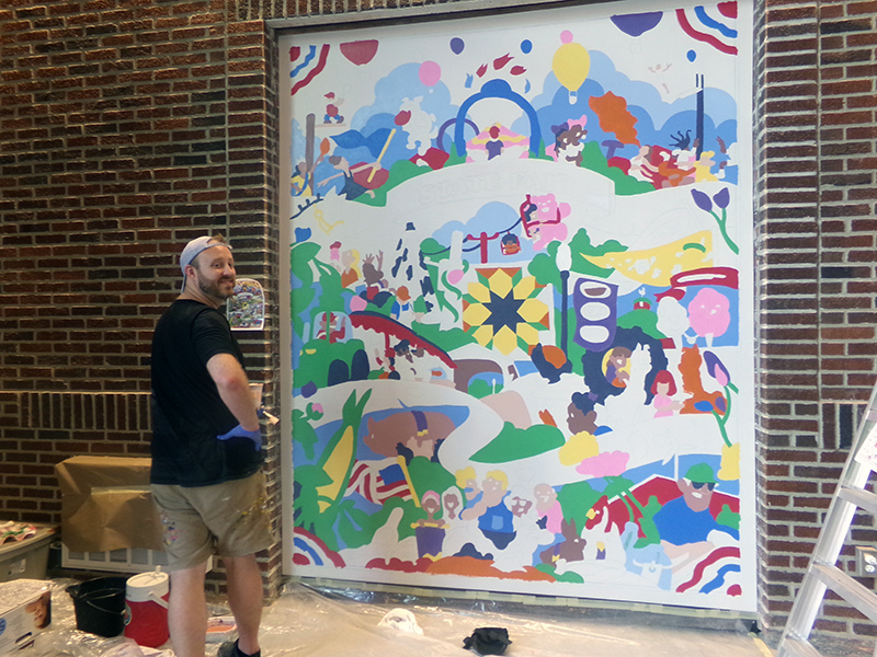 Painting a mural in the new Swine Pavilion