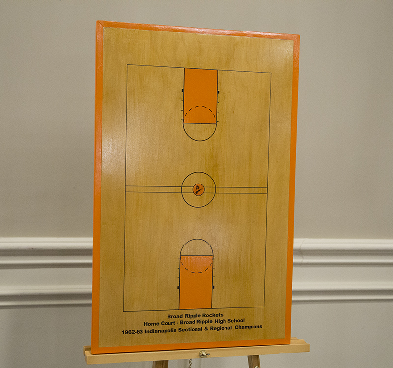 A scale model of the 1962 basketball court at BRHS. It was slightly short for regulation so they had two midcourt lines to make up the lost measurement. The jump ring in the center of that original court is still visible in a cutout of the carpet in the library at the school.