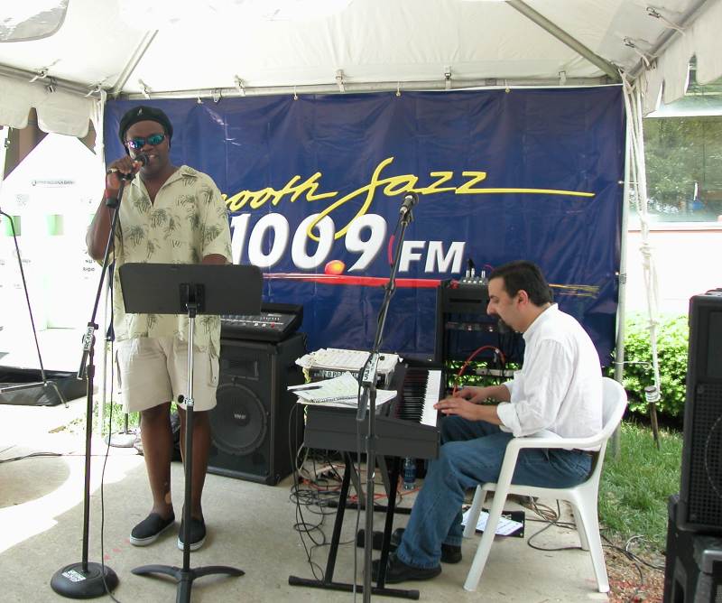 Jazz performers Cliff White and Roberto Monsalve on the Portico Stage, sponsored by 100.9 WYJZ.