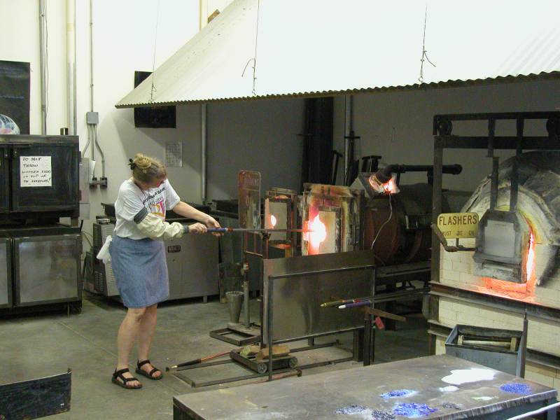 Glass blowing demonstrations continued all day at the glass workshop at the Indianapolis Art Center .