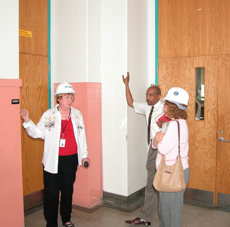 Sarah Bogard, vice principal of buildings and grounds, wears a hard hat in order to tour the construction areas.