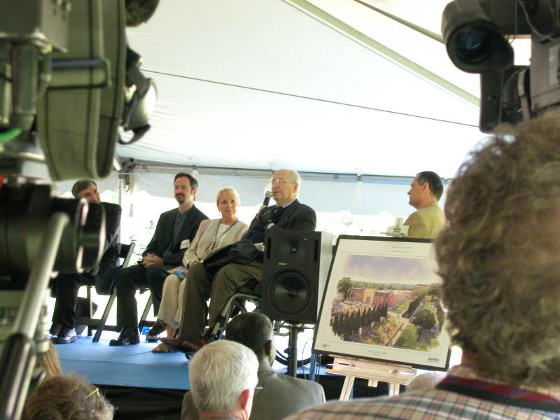 Joyce Sommers, president and executive director of the Indianapolis Art Center, listens as architect Michael Graves describes the design of ARTSPARK.