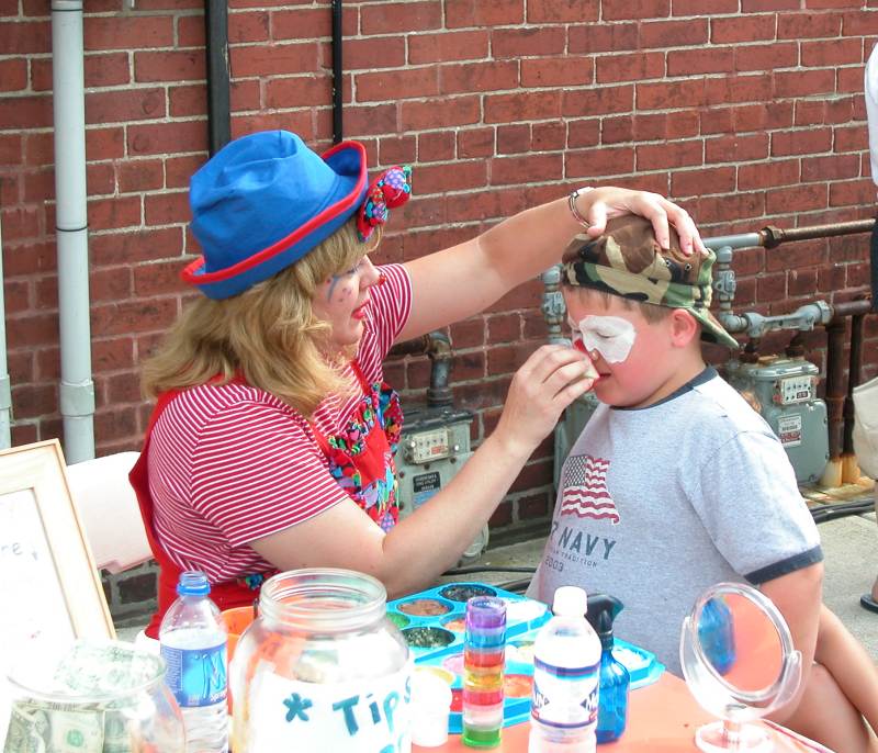 Face painting in the Kiddieland area of the Taste.