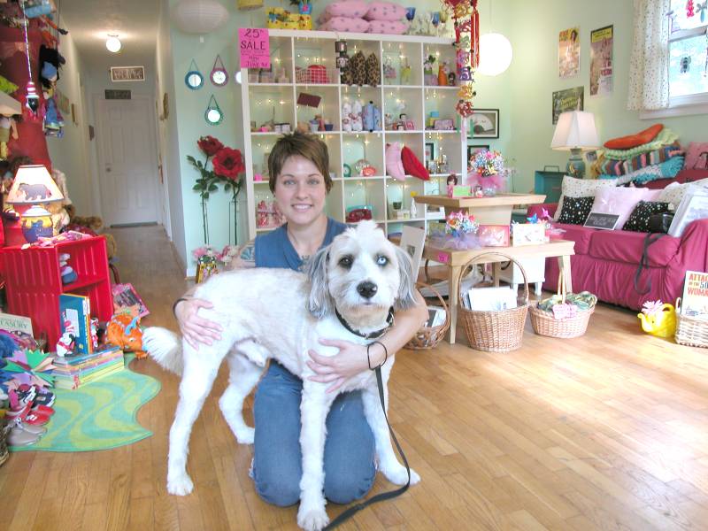 Amy Mullins, owner of Two Sisters, with lovable Charlie. Yes, he has two different colored eyes.