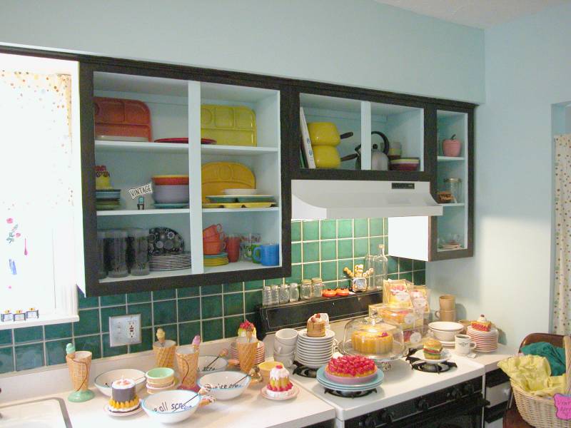 The original kitchen is a perfect display for vintage dishes and the food candles and timers