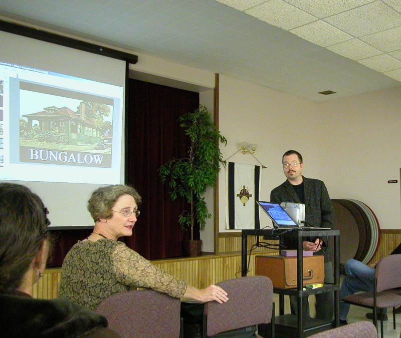 Kipp listened as Sue Zilich described the upcoming 2005 Bungalows of Broad Ripple home tour.