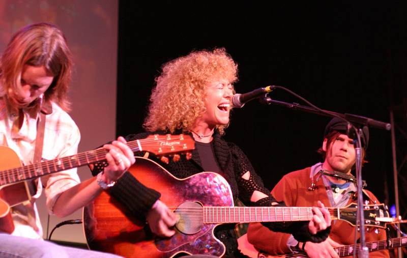 Jennie DeVoe entertained the Vogue crowd in the MMS Songwriters in the Round as Cameron McGill looked on.