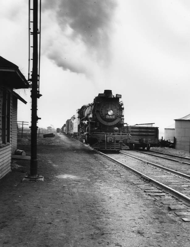 The Nickel Plate 587 engine pulling a local freight train through Cheneyville, Illinois in the winter of 1953.