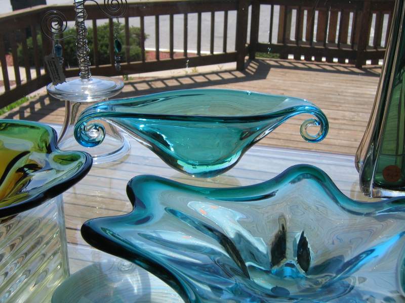 Antique Murano glass shines in the window.