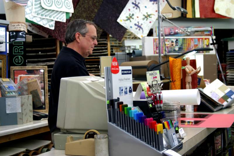 Michael McCune working the cash register