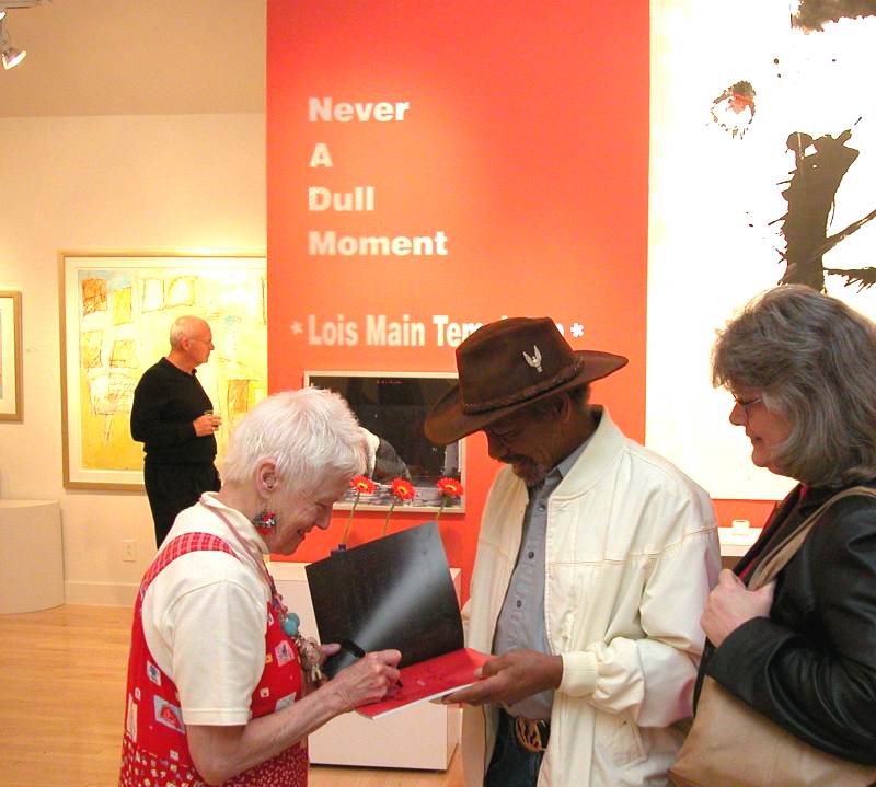 Editions Limited gallery - Lois Main Templeton autographed her art catalog for local jazz drummer Harold Caldwell.