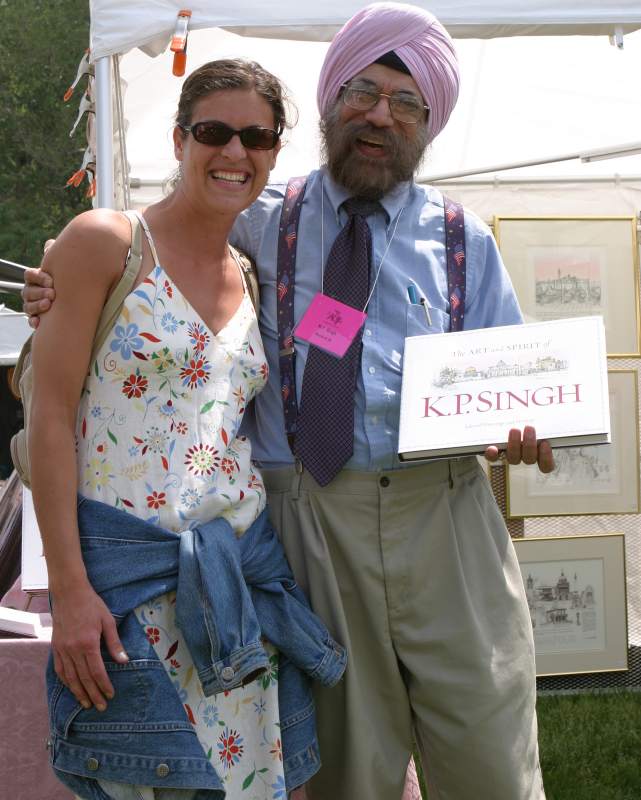 K.P. Singh is not only a talented artist; he also has the commercial acumen to make sure we included a beautiful young lady and his book in our picture.