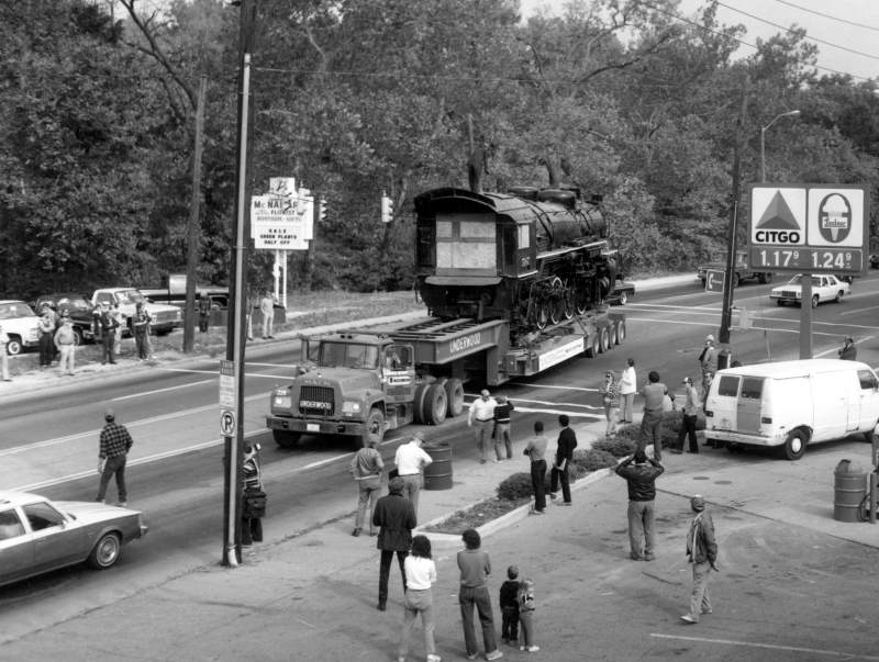 The 587 loaded on the trailer, passing through the intersection of Broad Ripple Avenue and Compton Street. Look at those gas prices at the Citgo!
