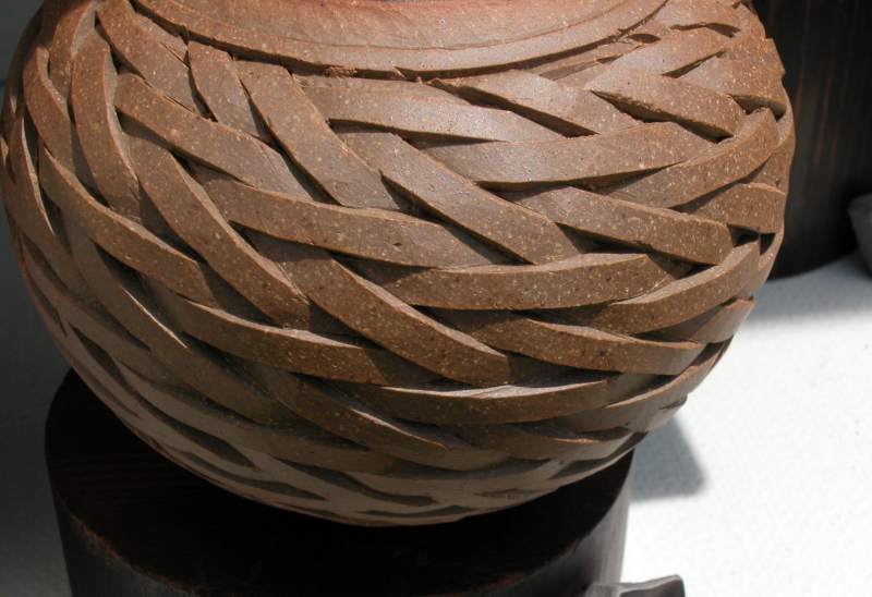 Intricately carved pottery looked woven.