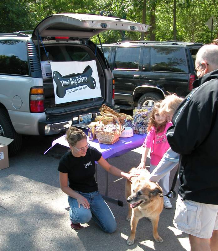 Stacy Petcu from Three Dog Bakery greeting a potential customer.