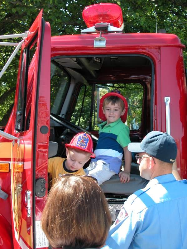 Two young firemen in the IFD rescue truck.