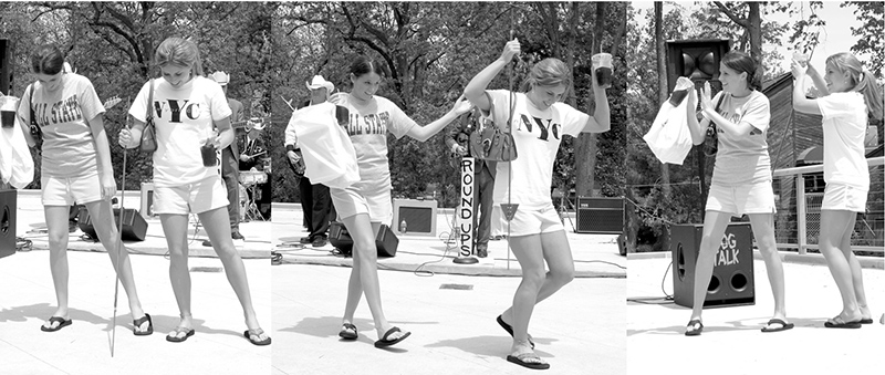 The Roundups were more than these two girls could resist. They broke into an impromptu line dance.