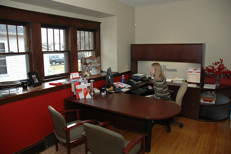 Elizabeth Ricke's State Farm office complete with the original woodwork and windows.