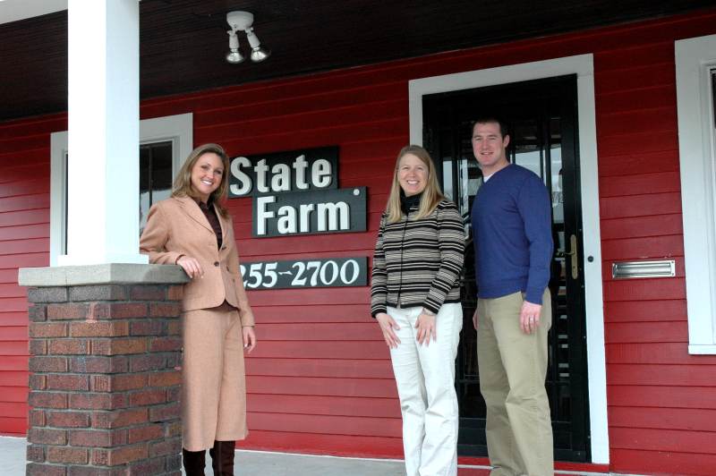 Nickie Powers, Elizabeth Ricke, and Chris Folliard on the porch at 6124 College Avenue.