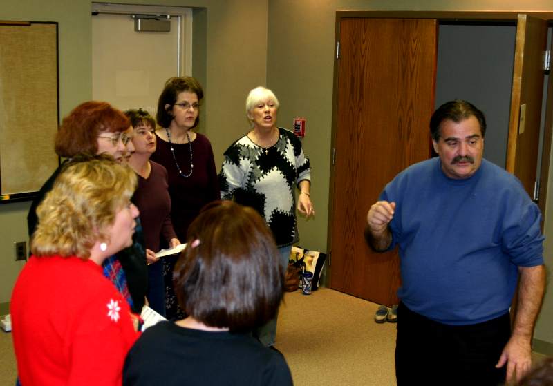The Heart of Indiana singers rehearsing with director Allen Hatton.
