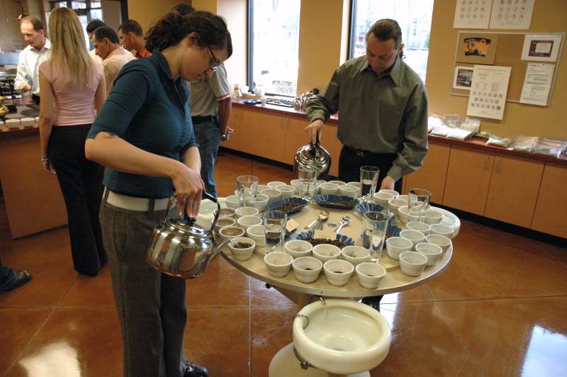 Katie Garvey prepares the coffee samples at the cupping table.