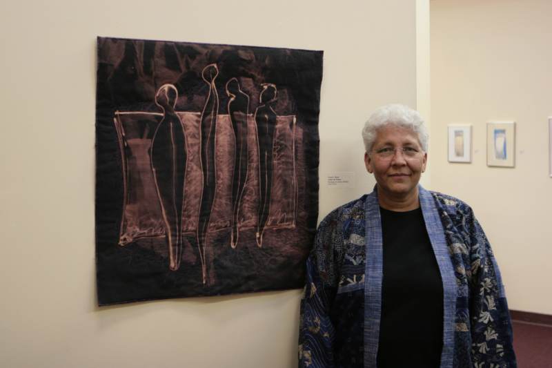 Artist Carol Myers, at the Cultural Complex Consortium, with her textile print titled 