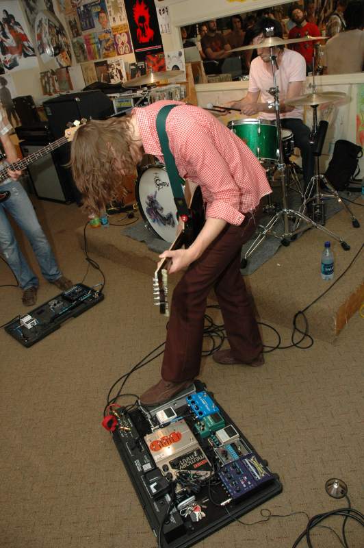 Mike Sullivan, Colin DeKuiper, and Dave Turncrantz are Russian Circles. Note guitarist Mike Sullivan's impressive effects board.