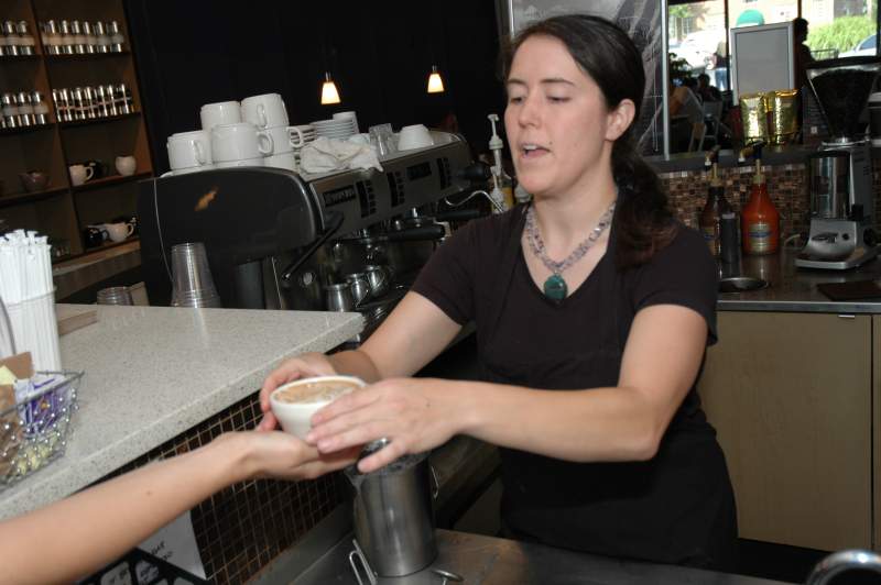 Sarah passes her latte etching to the judges.