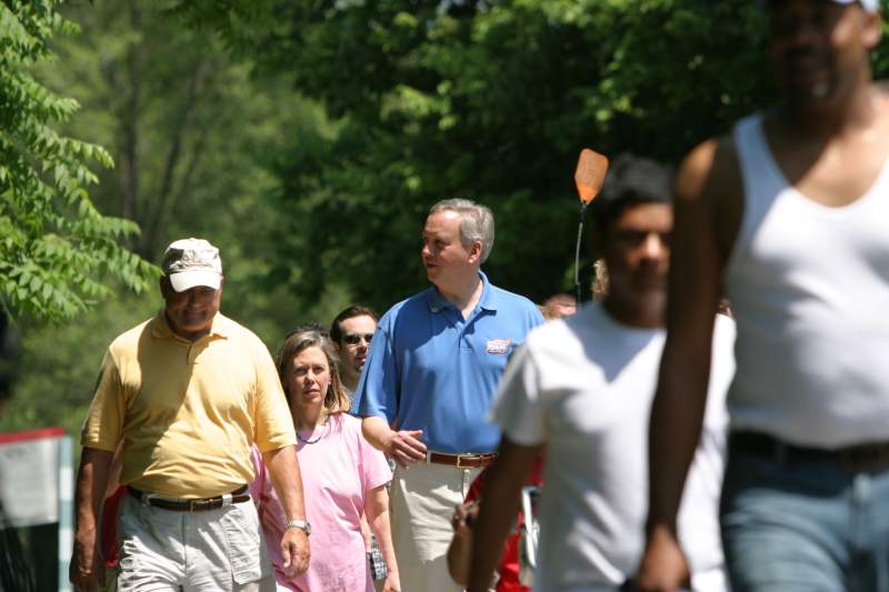 Ray Irvin and Mayor Bart Peterson discuss the growing use of the Monon trail while walking from the Indianapolis Art Center to the Depot for the 10th anniversary celebration of the Monon Trail. BRVA Executive Director Sharon Freeland joined them along with many citizens enjoying the trail on a warm sunny Saturday.