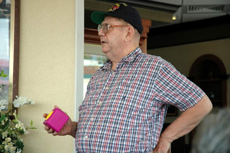 Phil Greenwood calls the numbers as they appear on his digital bingo cube.