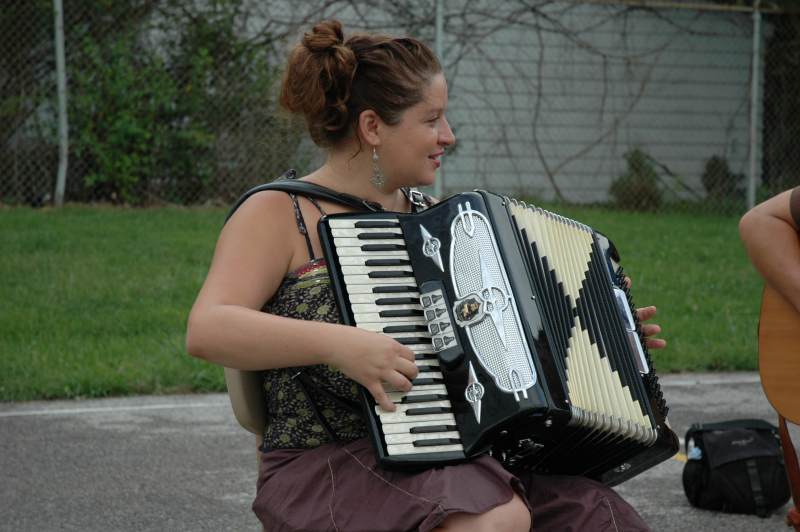 Stacia Demos and her accordion at the market.