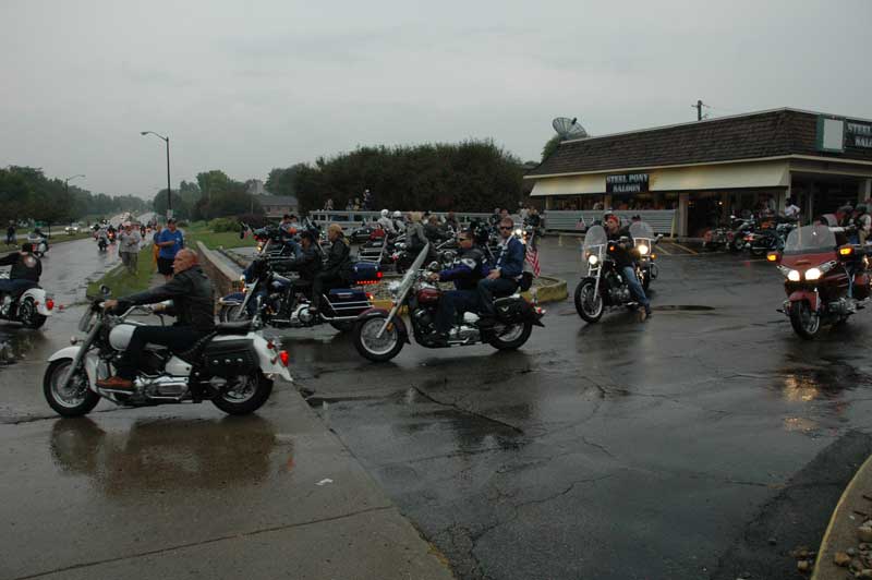 Cyclists leaving in the rain for a trek downtown.