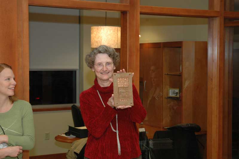 BRVA home tour coordinator Sue Zilisch with one of the plaques to be presented to the homeowners.