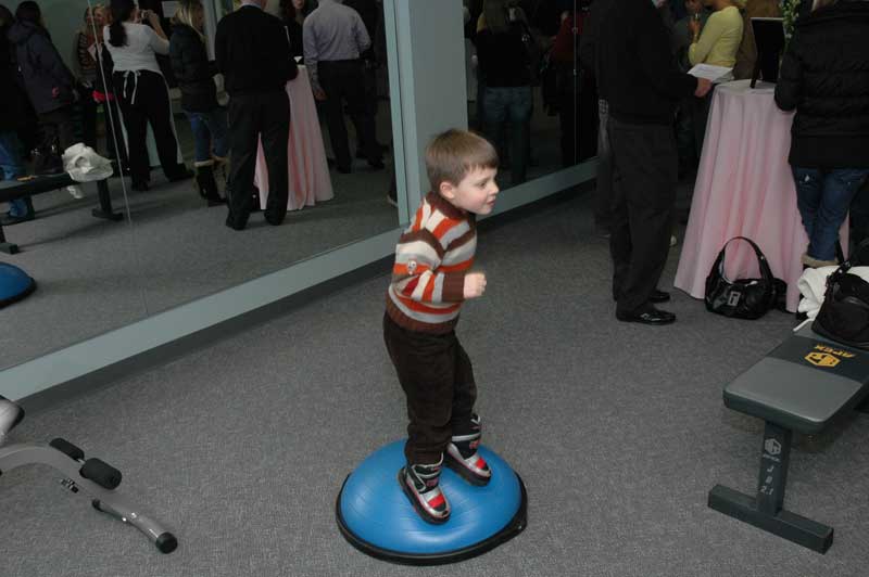 Evan gives impromptu Bosu ball demonstration at the grand opening party. 