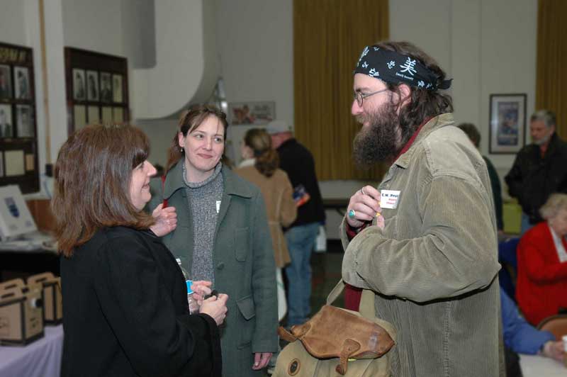 Nora Spitznogle, Tammy Lieber, and C.W. Pruitt II swap stories at the party.