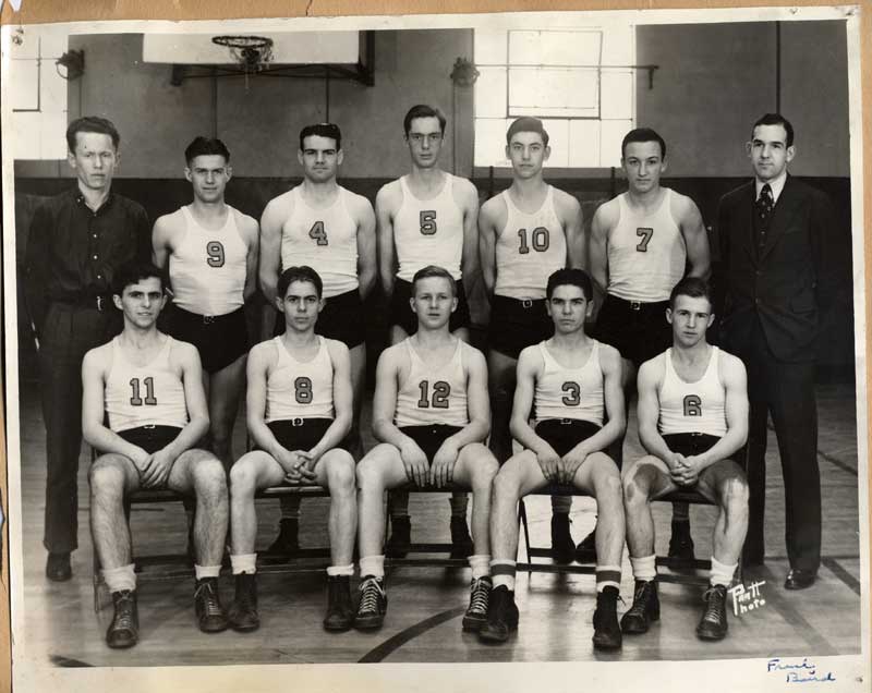 Wally Scott is #12, Coach Frank Baird is on the right end.