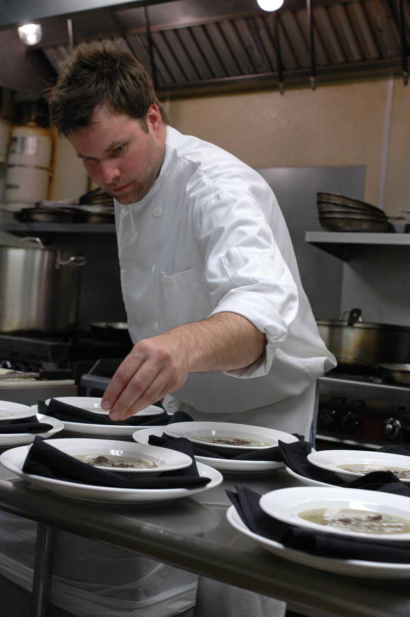 Neal adds finishing touches to the third course - Jerusalem Artichoke soup with fresh yogurt cheese.