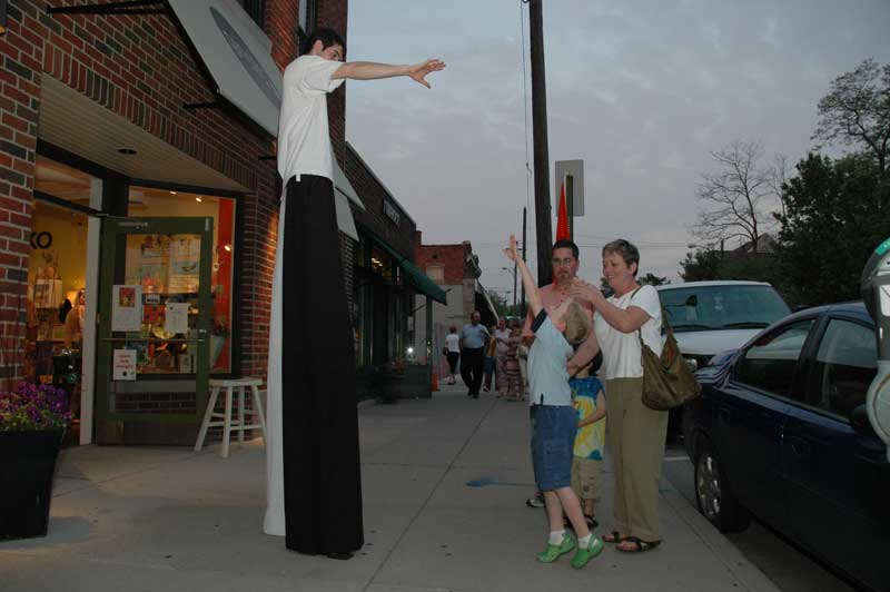 Jump!: Visitors enjoy Daniel Feltman on stilts, one of the entertainers present at the Spring Gallery Tour.