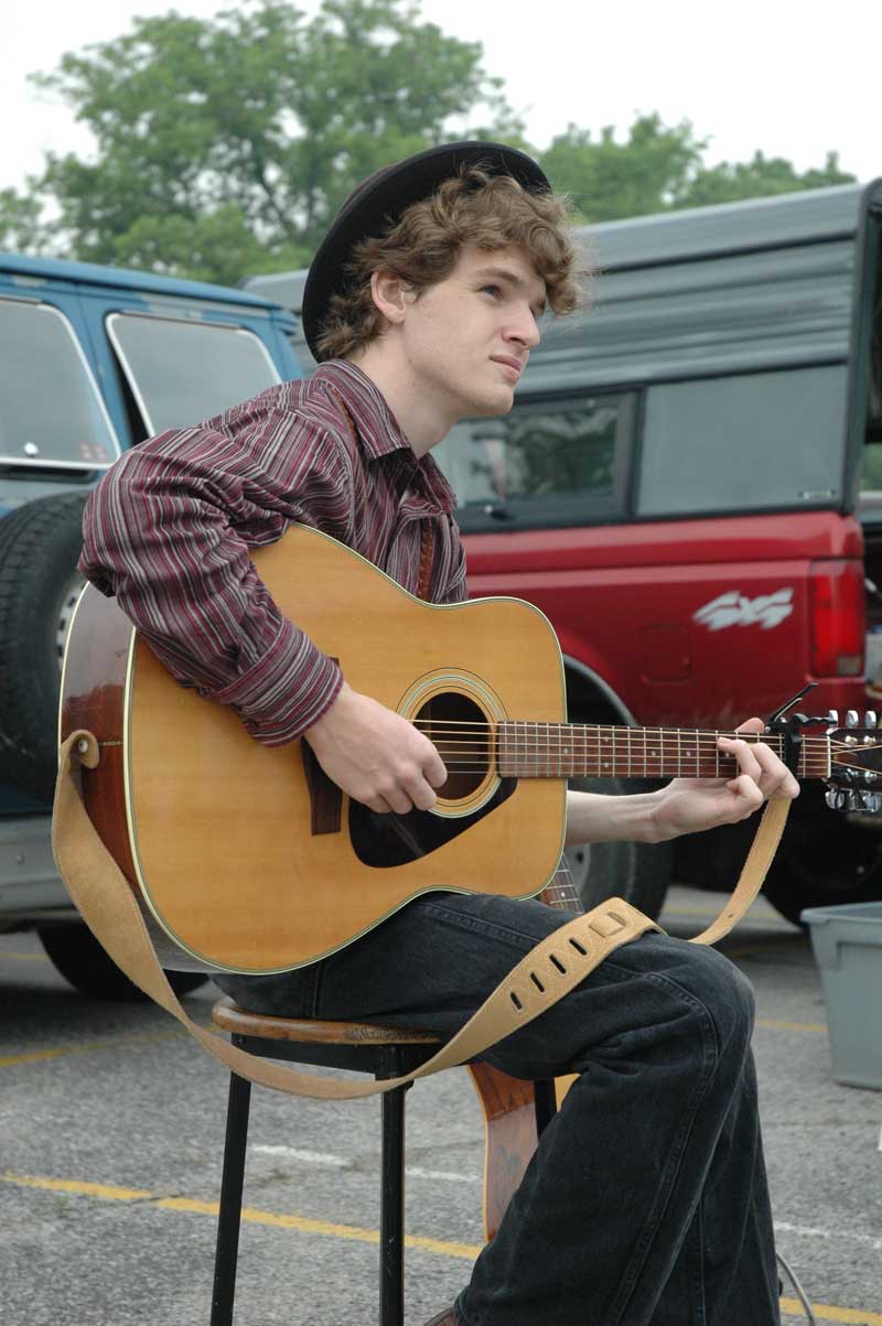 Caleb Hawkins entertained the crowds with his acoustic guitar and violin