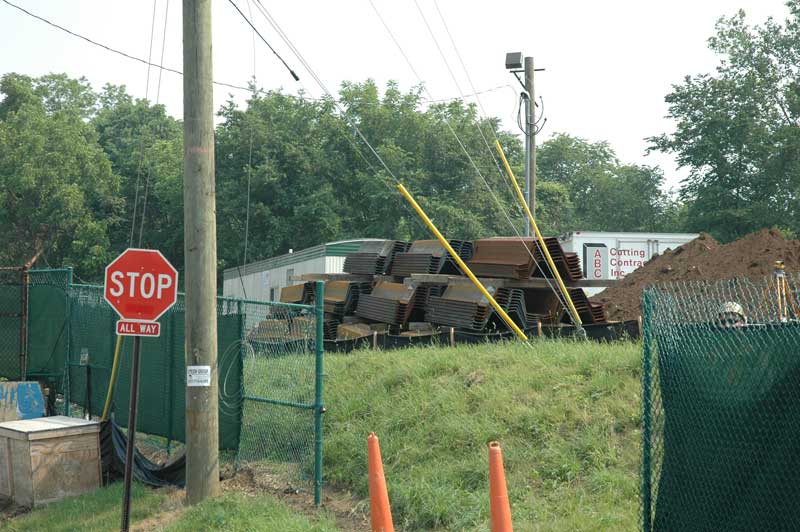 Corrugated steel pieces stacked awaiting to become the new levee wall along Westfield Boulevard.