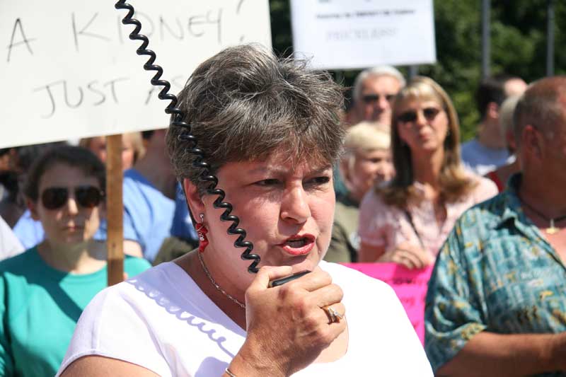 State Representative Cindy Noe (R-Indianapolis) attempts to speak over angry voices of taxpayers at a rally at the Governor's mansion on July 7, 2007.