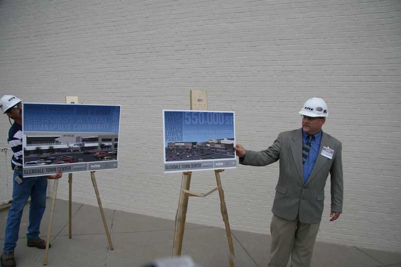 Hard hat tour guide Jay Krist explains a fraction of the new development to tour attendees. 