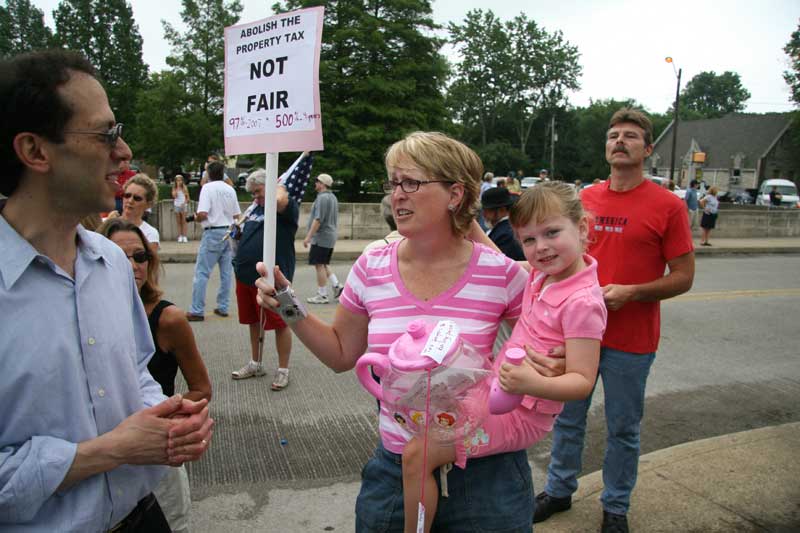 State Rep. David Orentlicher speaks with an angry taxpayer.