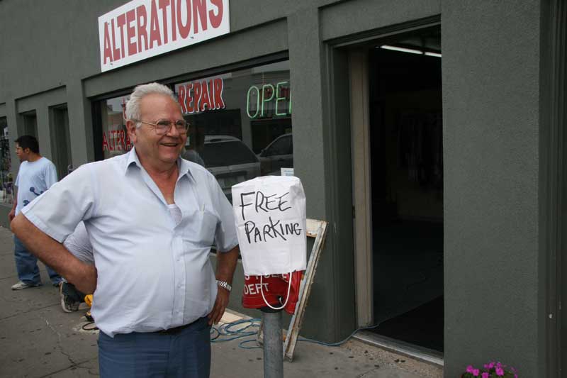 John Anagnostou of United Repair Service Alterations, located at 817 Broad Ripple Avenue, protests private bagging of village parking meters. 