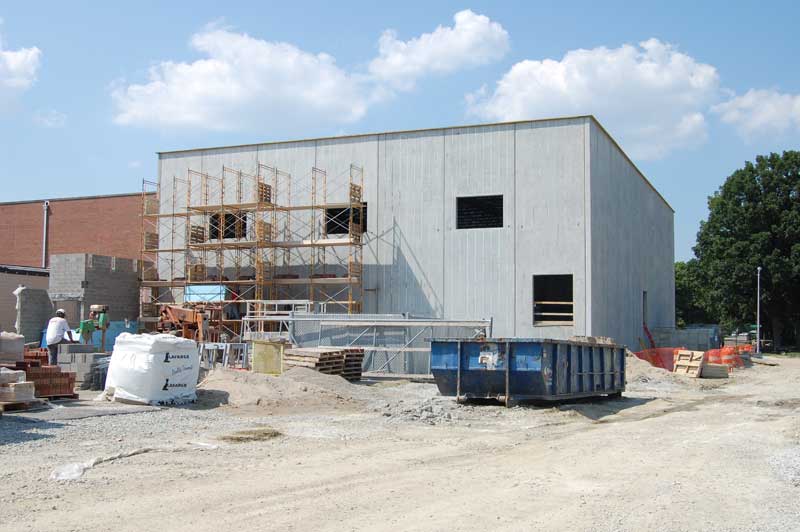 the most recent photo provided of the construction showing the brick veneer going up