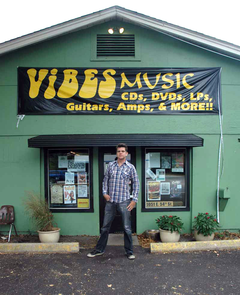 Area music icon John Zeps stands in front of the new Vibes store.