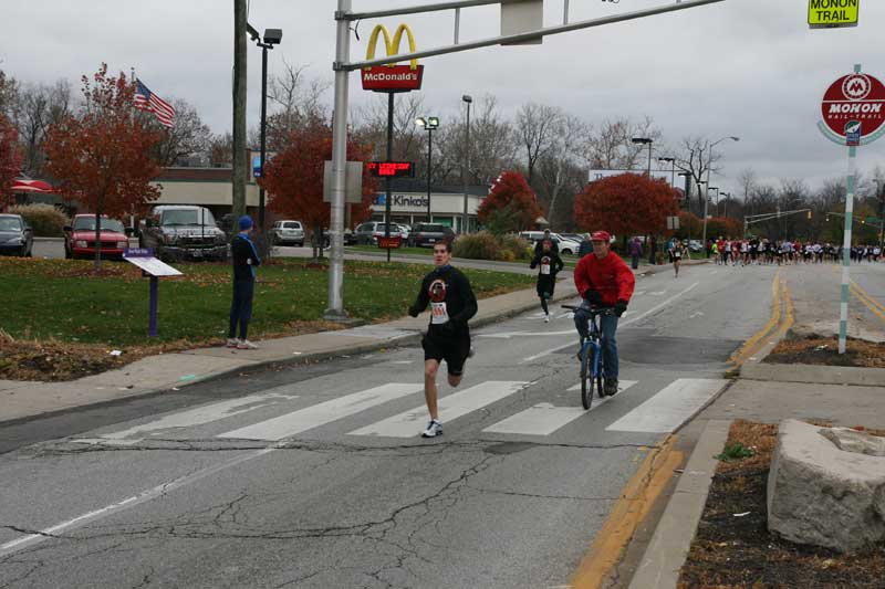The lead runner tries to catch the turkey