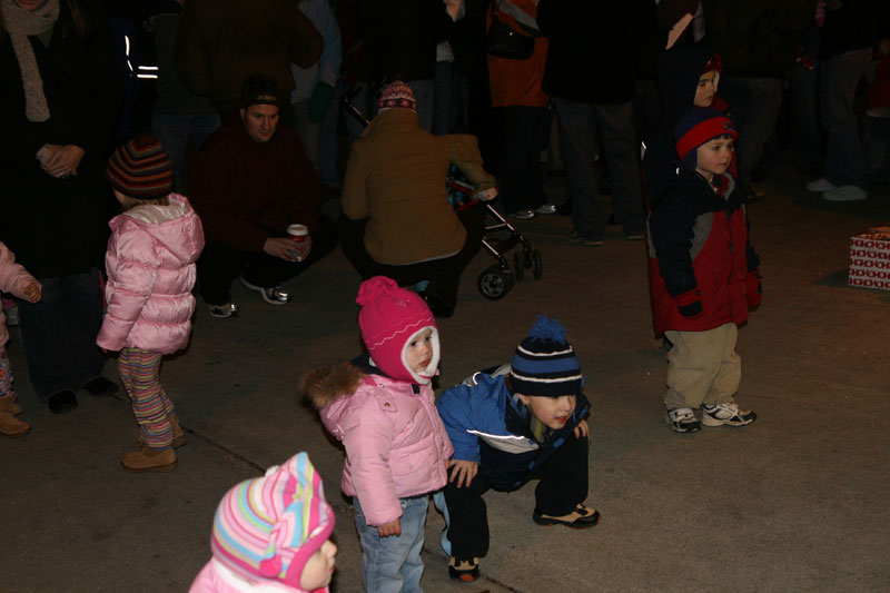 Tying to get a better view of Santa at the fire station.